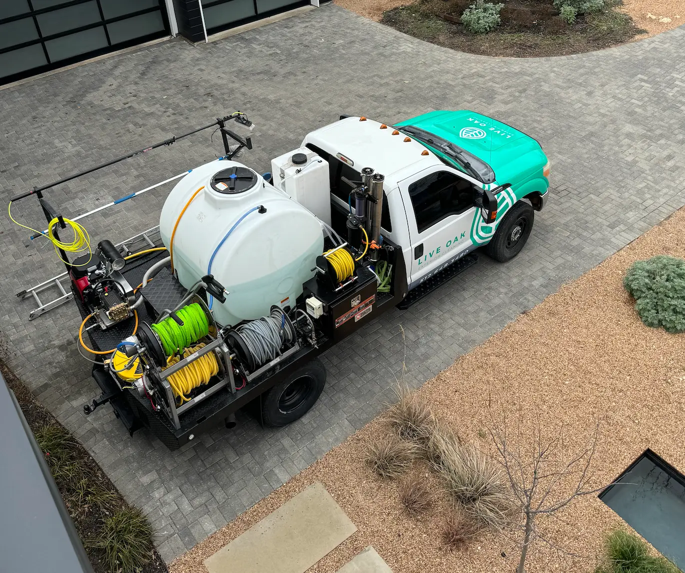 Before and after of a pressure washed driveway in Austin, TX